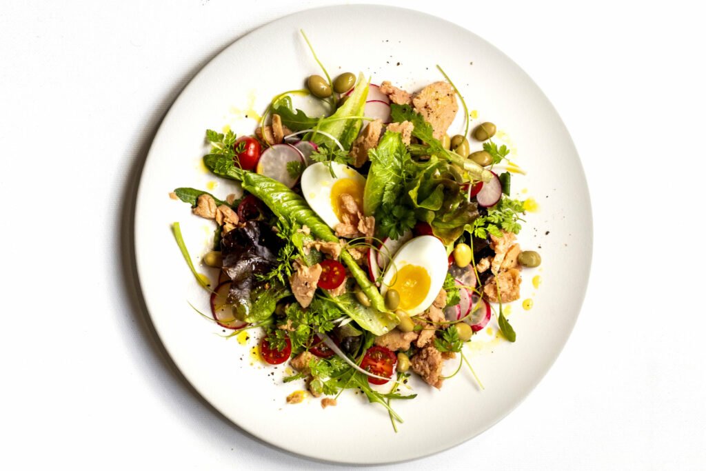 Green salad with vegan tuna and egg